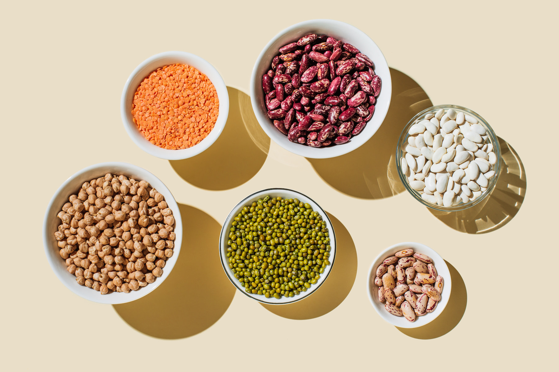 High-Fiber Foods: Assorted bowls of beans and lentils.
