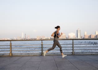 Woman running outside, the benefits of running every day
